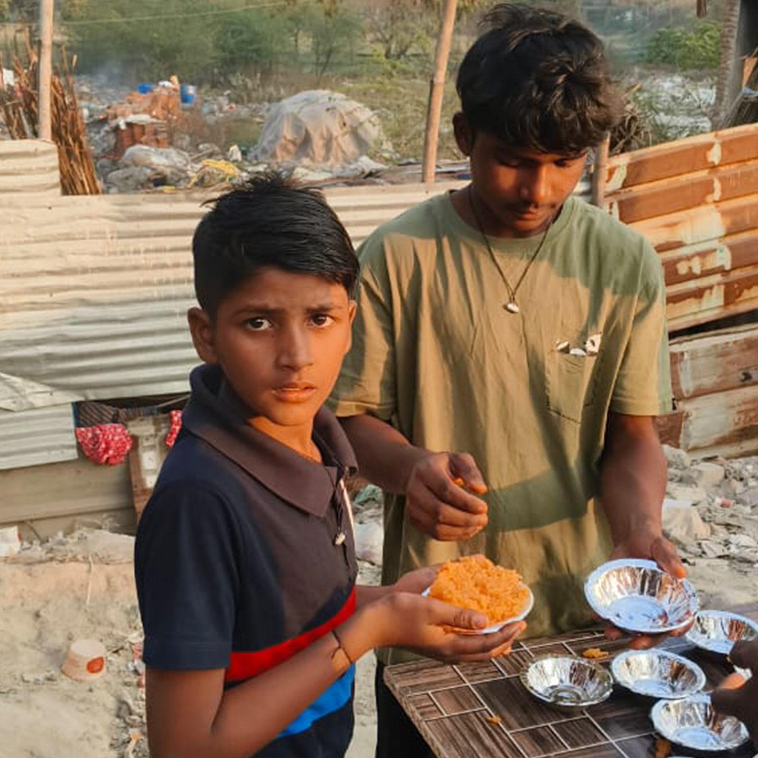 Children receiving meals during a community distribution